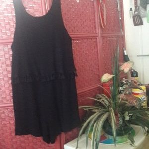 Cute Romper w/ pom pom trim . Looks like 2 pieces